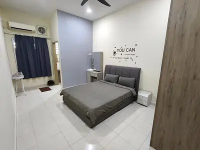 a bedroom with a bed in a room at My Homestay Sitiawan - Astronaut Space House 8 Pax in Sitiawan