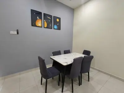 a dining room with a table and chairs at My Homestay Sitiawan - Astronaut Space House 8 Pax in Sitiawan