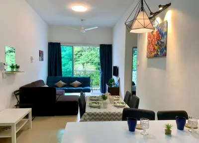 a living room with a couch and a table at New GoldenHill Condo 3BR 1Min Pasar Mlm Cameron Highlands in Tanah Rata