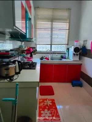 a kitchen with a sink and a counter top at Rumah Singgah in Pantai Remis
