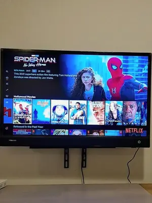a television screen with a spider man movie on it at Woodsbury Suites IKEA House Butterworth Penang in Butterworth