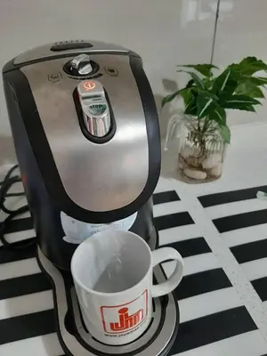 a coffee maker sitting on a table with a cup at Woodsbury Suites IKEA House Butterworth Penang in Butterworth