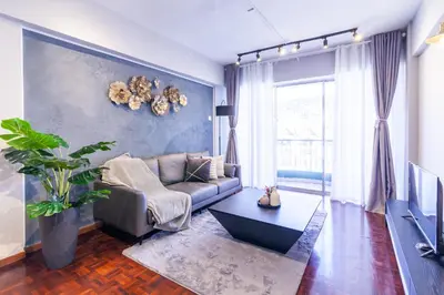 a living room with a couch and a table at Star Regency by Plush in Brinchang