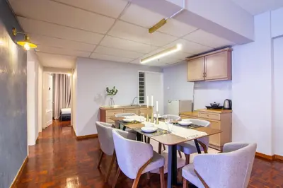 a kitchen with a table and chairs in a room at Star Regency by Plush in Brinchang