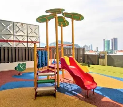 a childrens playground with a slide at Jazz Service Suites 2 bedroom 35-1 by Yen's Sojourn in Bagan Jermal