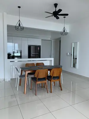 a kitchen with a dining room table and chairs at Jazz Service Suites 2 Bedroom 23-3 by Yen's Sojourn in Bagan Jermal