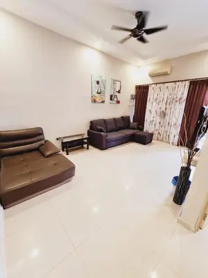 a living room with a couch and a ceiling fan at Air-home No135 Kampung Boyan, 3BR, 6pax Netflix in Taiping