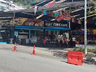 a street with orange cones in front of a restaurant at Nova Retreat Kea Farm Balcony Valley View in Brinchang