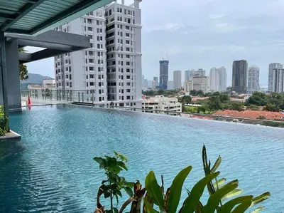 a large swimming pool on the roof of a building at The Palm, 2BR Cityview by WStay @ Tropicana 218 Macalister in George Town