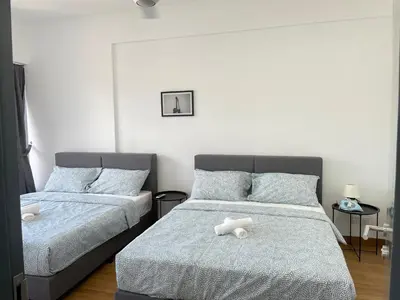 a bedroom with two beds with stuffed animals on them at The Aspen, 3BR Cityview by WStay @Tropicana 218 Macalister in George Town
