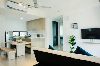 a kitchen and living room with a couch and a table at The Aspen, 3BR Cityview by WStay @Tropicana 218 Macalister in George Town