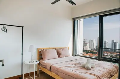 a bedroom with a bed with a large window at The Pine, 3BR Seaview by WStay @ Tropicana 218 Macalister in George Town