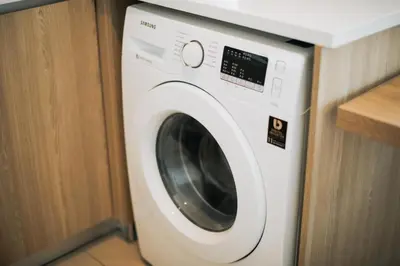 a white washing machine in a room with a counter at The Pine, 3BR Seaview by WStay @ Tropicana 218 Macalister in George Town