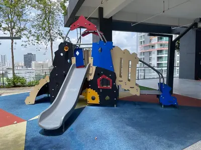 a playground in a building with a slide at The Pine, 3BR Seaview by WStay @ Tropicana 218 Macalister in George Town
