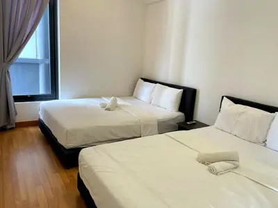 a hotel room with two beds and a window at Timeless, 3BR Cityview by WStay @ Tropicana 218 Macalister in George Town