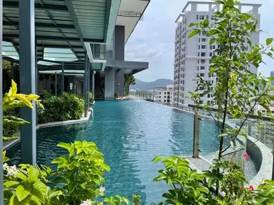 a swimming pool in the middle of a building at Timeless, 3BR Cityview by WStay @ Tropicana 218 Macalister in George Town