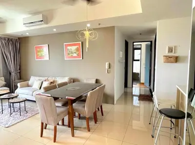 a living room with a table and a couch at The Ash, 3BR Seaview by WStay @ Tropicana 218 Macalister in George Town