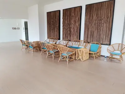 a group of chairs and tables in a room at By The Sea Batu Ferringhi Beach Front, Seaview And Pool Front in Batu Ferringhi