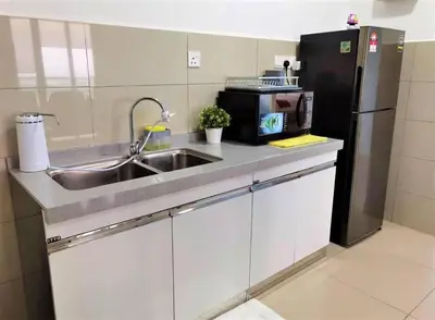 a kitchen with a sink and a refrigerator at WOODSBURY PREMIER LUXURY SUITE 2B2R 2MIN SUNWAY in Butterworth