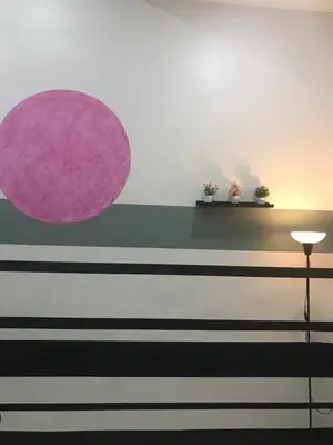 a room with a purple circle on the wall at Koolest homestays Meru in Ipoh