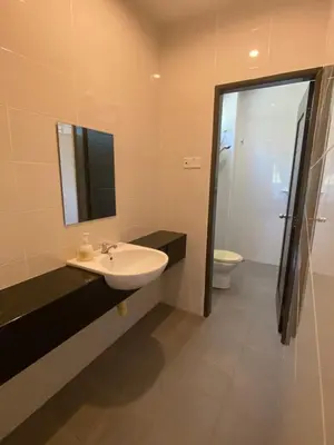 a bathroom with a sink and a toilet and a mirror at 25PAX 5BR Villa Kids Swimming pool, KTV, BBQ near SPICE Arena Penang 9800 SQFT in Bayan Lepas
