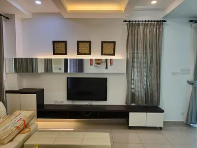a living room with a flat screen tv on a wall at Prestij 3 Homestay, Balik Pulau in Balik Pulau