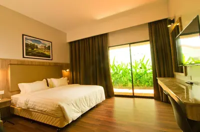 a hotel room with a bed and a large window at MyDream Guest House in Ipoh