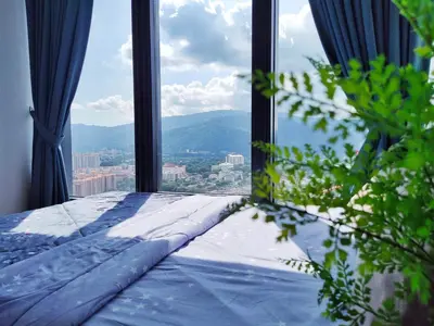 a room with a window with a view of a city at New Georgetown Tropical Macalister 218 Homestay 9pax to11pax HENG in George Town