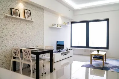 a dining room with a table and chairs and a television at New Georgetown Tropical Macalister 218 Homestay 9pax to11pax HENG in George Town