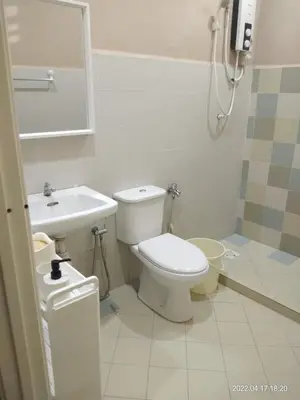 a bathroom with a toilet and a sink at Park Villa Homestay in Sungai Petani
