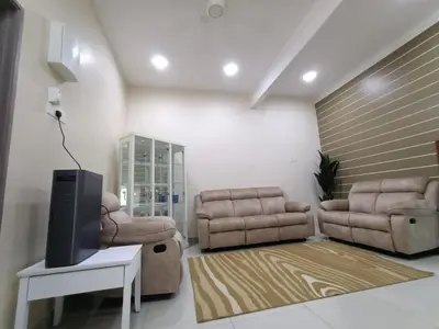 a living room with two couches and a tv at Rumah Hana Sungai Besar - Mslim0nly in Sungai Besar
