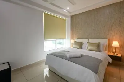 a bedroom with a large bed and a large window at 2R1B/Seaview Tropical /1~8Pax/Gurney Mansion One in George Town