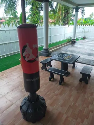 a red cup sitting on top of a table at Villa Auliyya - MusleemHomestay in Kampong Sungai Leman