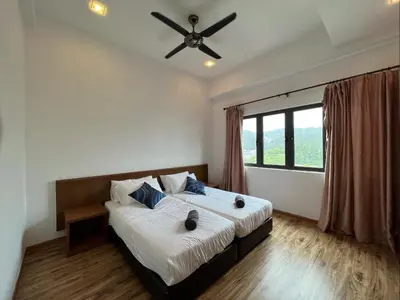 a bedroom with a large bed with a ceiling fan at NEW 6pax 3BR Sunrise view 100m Attractive Places Kea Farm in Cameron Highlands