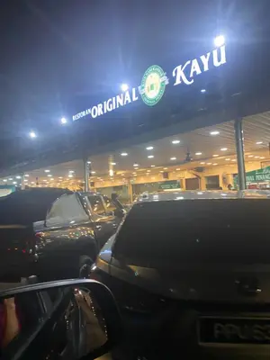 a kiwi car dealership with cars parked in front at NEW 6 PAX SUITE near USM and SPICE ARENA and AIRPORT in Bayan Lepas