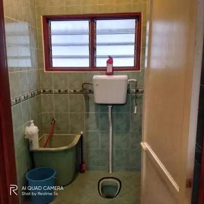 a small bathroom with a toilet and a window at Zulkifli Homestay Tambun,Ulu kinta,Tg Rambutan in Ipoh