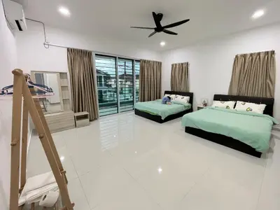 a bedroom with two beds and a ceiling fan at LOW SEASON PROMOTION! 4B12B Mountainville Bungalow in Ipoh