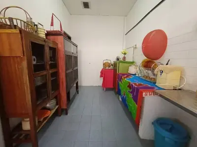 a room with a kitchen with a counter and a unintention at HEAWOOD GUEST HOUSE Sungai Siput in Sungai Siput