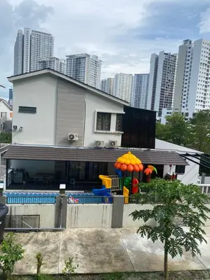 a house with a playground in front of a building at 15PAX 3 BR, Kids Swimming Pool, Pool table, BBQ near Spice ARENA, Airport Penang in Bayan Lepas