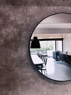 a mirror reflecting a dining room with a table and chairs at 80 Colonie Fraser's Hill 4pax in Bukit Fraser