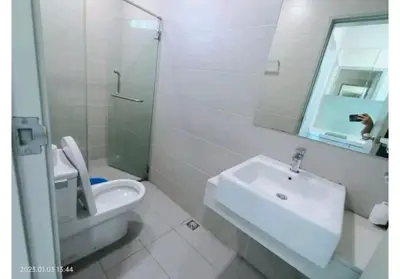 a bathroom with a sink and a toilet and a mirror at City Town 2-6 Pax Beautiful View Cozy Condo, Jelutong, Georgetown, Centre Heart Of Penang Island, near Highway Komtar Gurney in George Town
