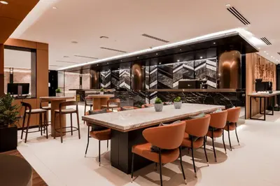 a bar in a restaurant with chairs and tables at Citadines Connect Georgetown Penang in George Town