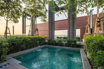 a swimming pool in front of a building at Lovers under Cupid's Arrow 丘比特之箭下の恋人 in Butterworth