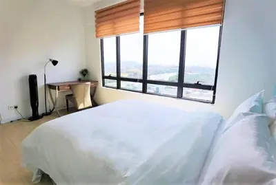 a bedroom with a large white bed and a large window at Lovers under Cupid's Arrow 丘比特之箭下の恋人 in Butterworth