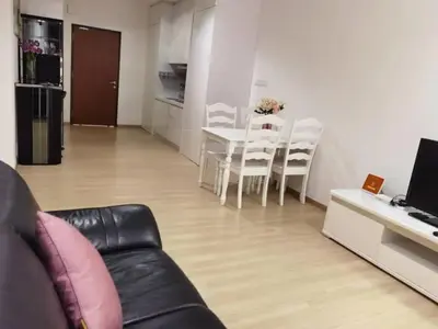 a living room with a couch and a table and chairs at YOU & ME 118 SWEET HOUSE in Tanjong Tokong