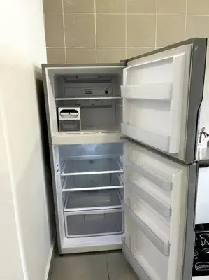 an empty refrigerator with its door open in a kitchen at Azzalea Homes 6 @ Taman Golden Hills Cameron Highlands in Tanah Rata