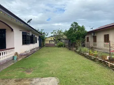 a yard of a house with a grass yard at LOST WORLD OF TAMBUN HOMESTAY in Kampong Batu Lapan