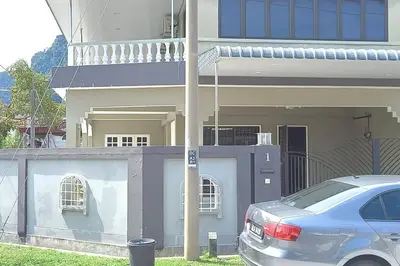 a car parked in front of a house at 5 Bedroom 2 Bathrooms End-lot House, 3 parkings - Ipoh, Tambun in Ipoh