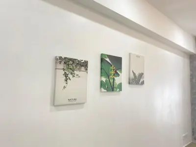 three pictures hanging on a wall in a room at \u4f11\u95f2\u6c11\u5bbf Leisure Homestay @The Venus Sitiawan in Kampong Lumut Kiri