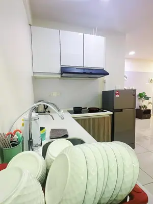 a kitchen with a sink and white plates on a counter at The Majestic Ipoh Town by 178homestay in Ipoh